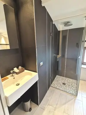 a bathroom with a shower and a sink at Le Métro in Carini