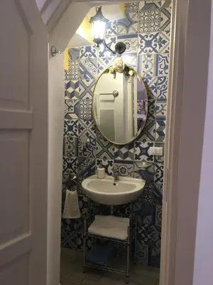 a bathroom with a sink and a mirror at Le Lanterne di Terrasini in Terrasini