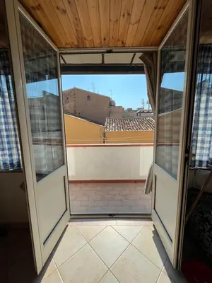 a view from the inside of a room with sliding glass doors at Casa Vacanze Salvatore in Balestrate