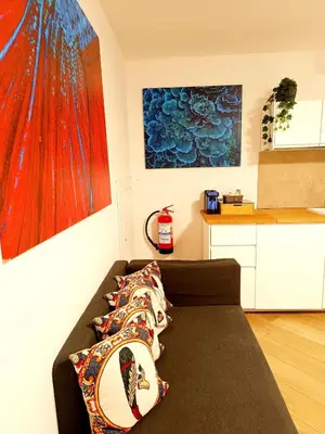 a living room with a couch with pillows on it at Diatomea in Palermo