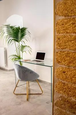 a desk with a laptop and a chair in a room at Casta Diva Luxury Apartments -Self check-in in Palermo