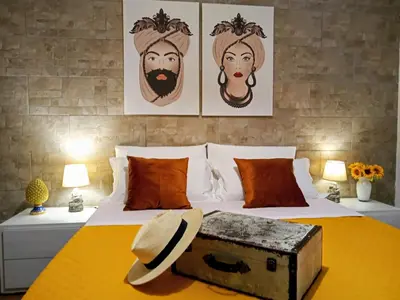 a bedroom with a bed with a trunk on it at Zisa Home ai Cantieri Culturali con Patio Privato - vicino centro storico - No ZTL in Palermo