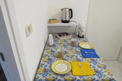 a table in a room with a table cloth on it at Sofi apartment in Palermo