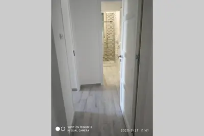 a hallway with an open door to a room at Home sweet home appartamento ricco di comfort in Palermo