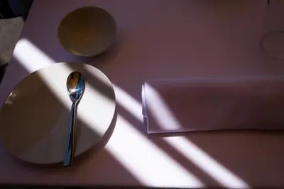 a spoon sitting on a plate on a table at Hotel Borgo di Ciàula in Santa Flavia