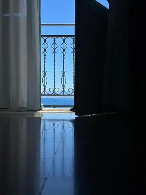an open door to a balcony with a gate at Hotel Borgo di Ciàula in Santa Flavia