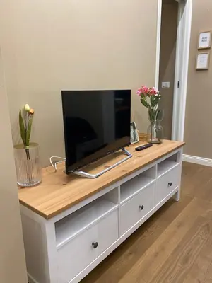 a tv on top of a dresser in a room at Apartament la Lumaca Kalsa in Palermo