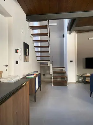 a hallway with a spiral staircase in a building at Le dimore di Palagonia in Bagheria