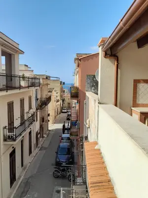 a view from a balcony of a street with buildings at Sandro Apartment in Castellammare del Golfo