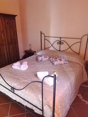 two pillows sitting on top of a bed at Casa vacanze Butterfly in Trabia