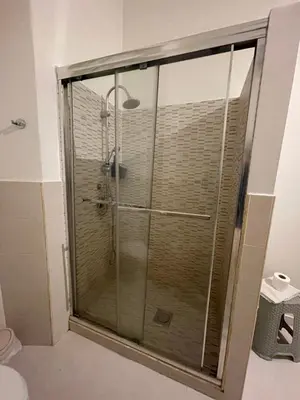 a shower with a glass door in a bathroom at 100 PASSI al Massimo in Palermo