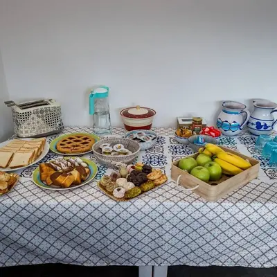 a table with many different types of food on it at Villa Michelangelo in Castellammare del Golfo