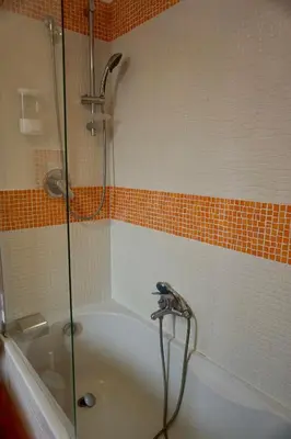 a bathroom with a shower and a bath tub at B&B Vivaldi in Palermo