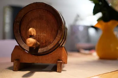 a small wooden drum on a table with a vase at Casavacanze Tuttapposto in Palermo