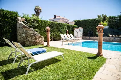 a yard with chairs and a swimming pool at Dimora Fanale, Villa Esclusiva con Piscina Privata - Fanale Rentals in Altavilla Milicia