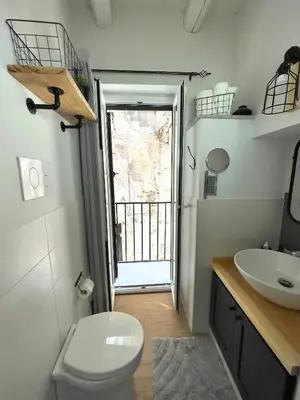 a bathroom with a toilet and a sink at Loft Mercede al Capo in Palermo