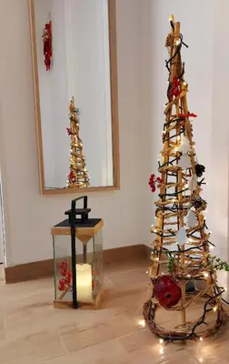 a christmas tree in a room with a mirror at Terrazza del Golfo in Castellammare del Golfo