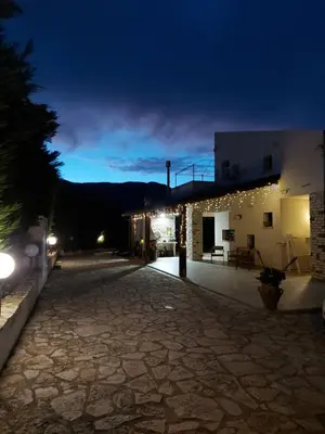 a night view of a building with lights on it at Terrazza del Golfo in Castellammare del Golfo