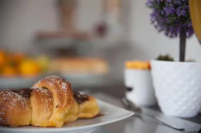 a pastry sitting on a plate on a table at Kristal in San Vito lo Capo