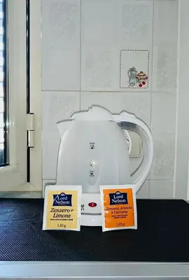 two signs sitting on top of a washing machine at Gabry central apartment Palermo in Palermo