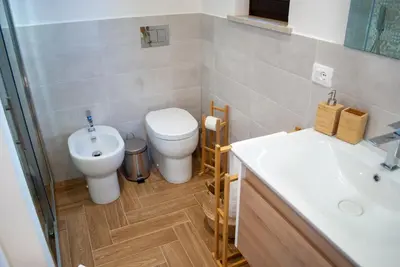 a bathroom with a toilet and a sink at La casa di Nemi a San Vito in San Vito lo Capo