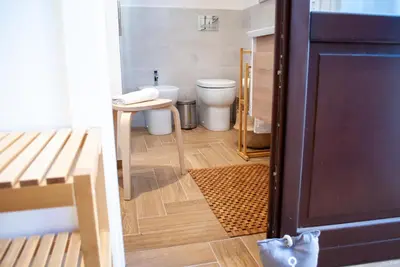 an open door to a bathroom with a toilet at La casa di Nemi a San Vito in San Vito lo Capo