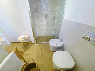 a bathroom with a toilet and a shower at La casa di Nemi a San Vito in San Vito lo Capo