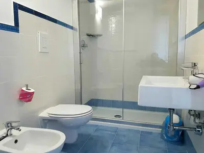 a bathroom with a toilet and a sink and a shower at Le Camere della Campana in Castellammare del Golfo