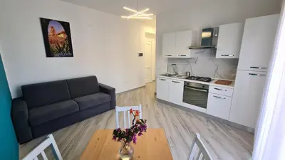 a living room with a couch and a table at Alberira Apartments in Palermo