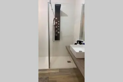 a bathroom with a sink and a shower at Delle Palme Rooms elegante monolocale in centro in Palermo