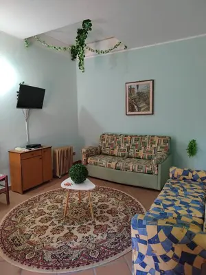 a living room with a couch and a table at Casa vacanze BY THE SEA in Trabia