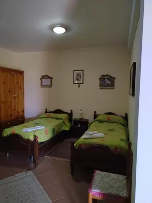 a room with two beds in a room at Casa vacanze BY THE SEA in Trabia