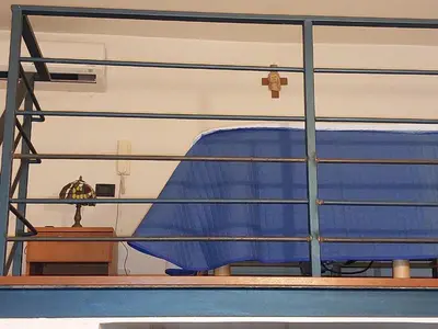 a blue couch sitting on top of a table at Palermo Centrocittà in Palermo