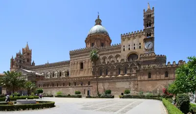 a large building with a clock tower on it at Palermo Centrocittà in Palermo