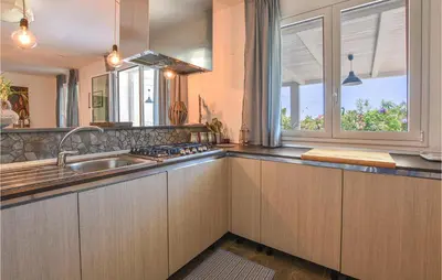a kitchen with a sink and a window at Gorgeous Home In Balestrate With Wifi in Balestrate