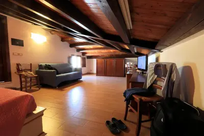 a living room with a bed and a couch at Sicilia Ovest - Sea View Terrace Antiche Scale in Castellammare del Golfo