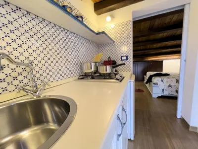 a kitchen with a sink and a counter top at Sicilia Ovest - Sea View Balcony Cerri in Castellammare del Golfo
