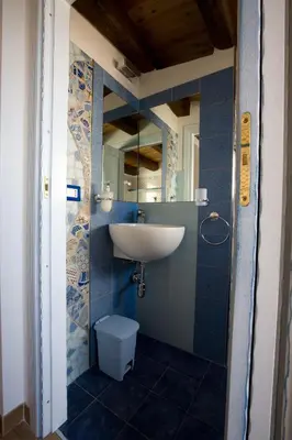 a bathroom with a sink and a toilet at Sicilia Ovest - Sea View Balcony Cerri in Castellammare del Golfo