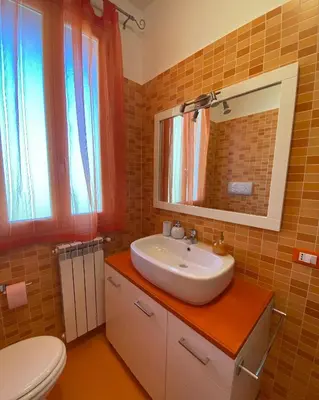a bathroom with a sink and a toilet at L'Oasi dell'Eremita in Mondello