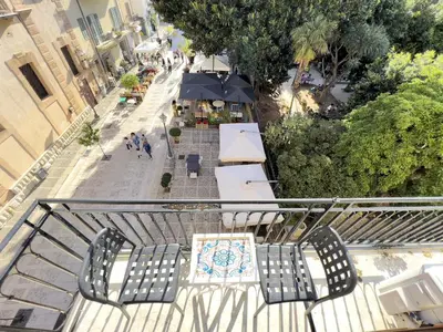 an overhead view of a balcony with chairs and tables at Sicilia Ovest - Balcone Bellavista in Castellammare del Golfo