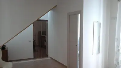 a hallway with a stairway leading to a room at Casa Vacanza Da Sofì in Cerda