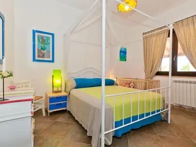 a bedroom with a canopy bed in a room at Villa Tenute Aversa by Interhome in Castellammare del Golfo