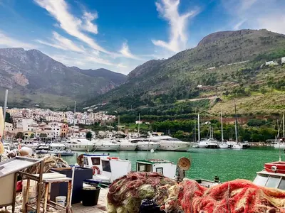 a group of boats docked in a harbor with mountains at Apartment Bouganville di Patrizia by Interhome in Castellammare del Golfo