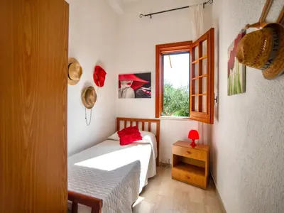 a small room with two beds and a window at Villa La Vela by Interhome in Scopello