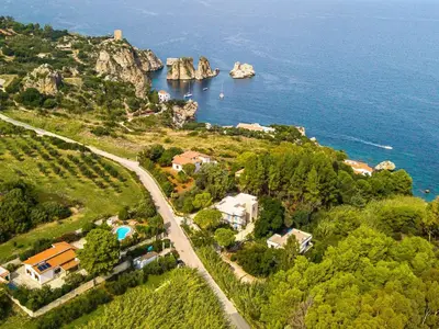 an aerial view of a small island in the water at Villa La Vela by Interhome in Scopello