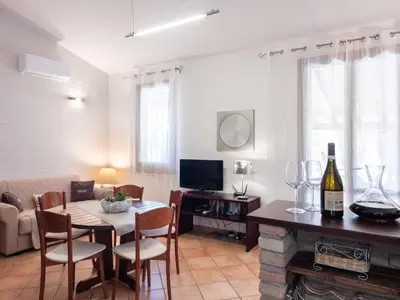 a living room with a table and chairs and a couch at Villa Nicole con Dependance by Interhome in Castellammare del Golfo
