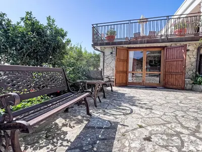 a group of benches sitting outside of a building at Apartment Edera di Patrizia by Interhome in Castellammare del Golfo
