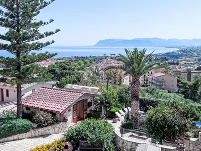 a view of a house with a palm tree at Apartment Edera di Patrizia by Interhome in Castellammare del Golfo
