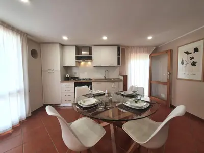 a dining room with a table and chairs in a kitchen at Apartment Edera di Patrizia by Interhome in Castellammare del Golfo