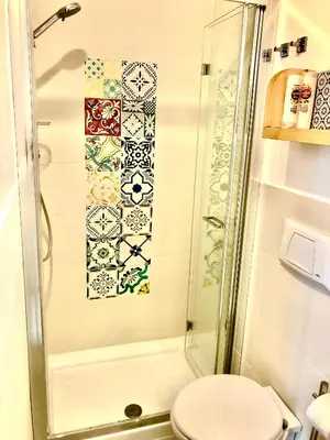 a bathroom with a shower and a toilet at Casa Colore Loft in Castellammare del Golfo